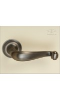 Riverwind lever & round rose 54mm | antique bronze | Custom Door Hardware 